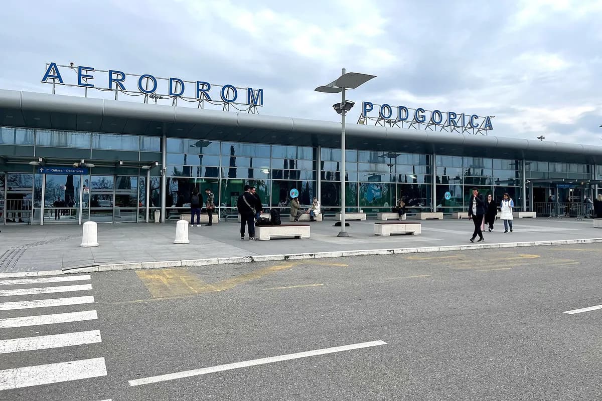 The terminal building at Podgorica Airport, with the Aerodrom Podgorica sign above the entrance.